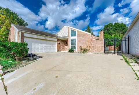 Photo of 14206 Langbourne Drive, Houston, TX 77077 (MLS # 42020354)