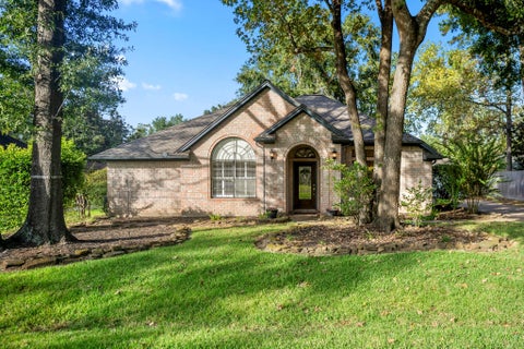 Photo of 812 Woodland Lane, Conroe, TX 77302 (MLS # 38463583)