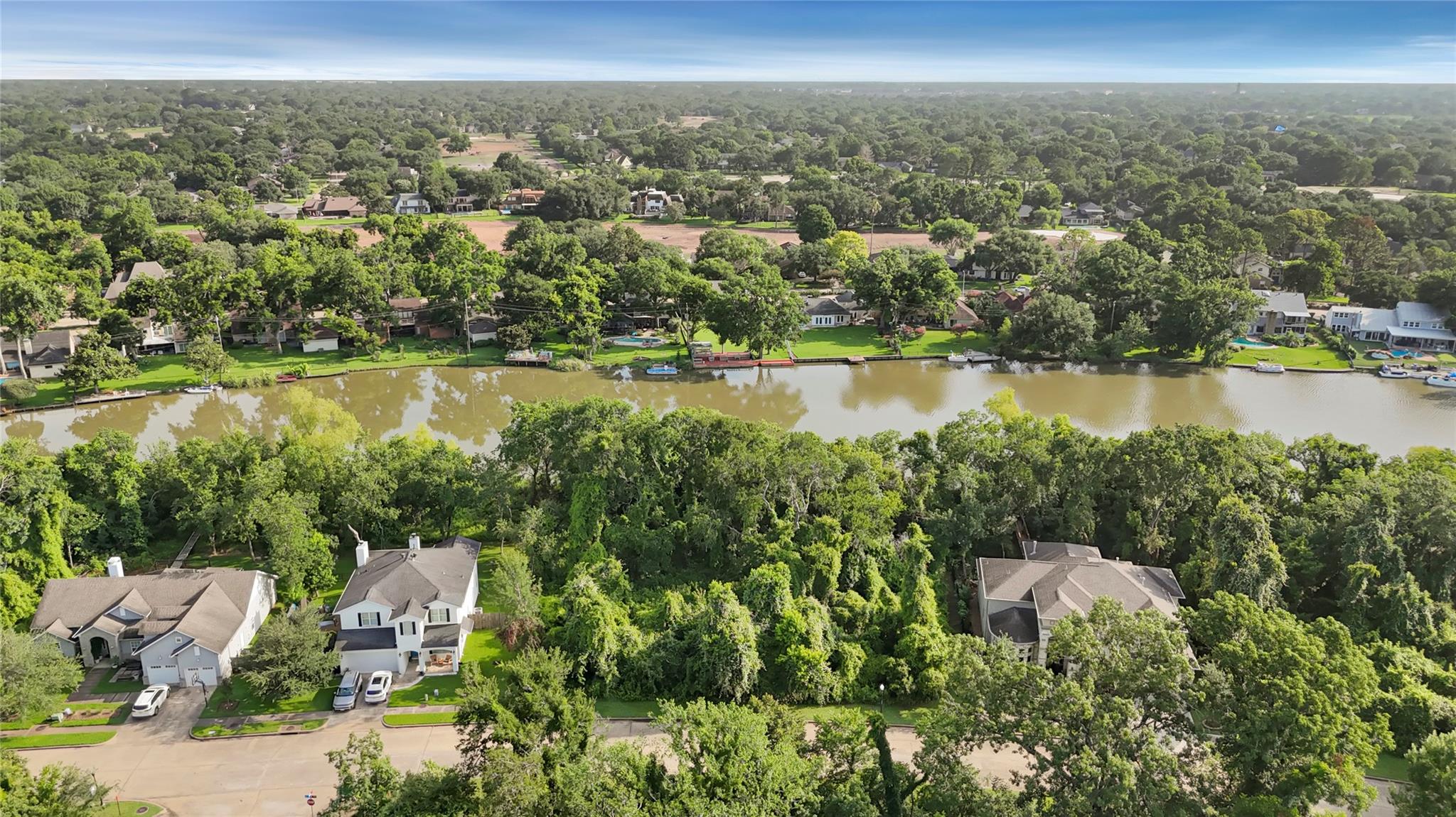 Beautiful wooded lot on water's edge. Ready for your custom home.