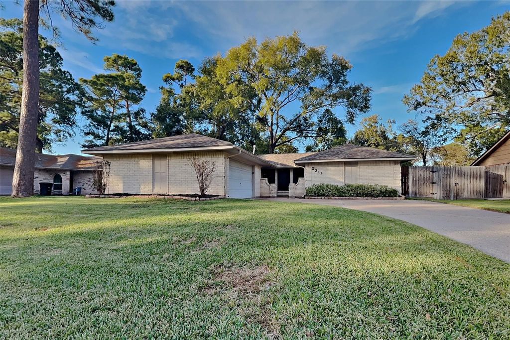 Photo of 2311 Whispering Winds Lane, Houston, TX 77339 (MLS # 68905665)