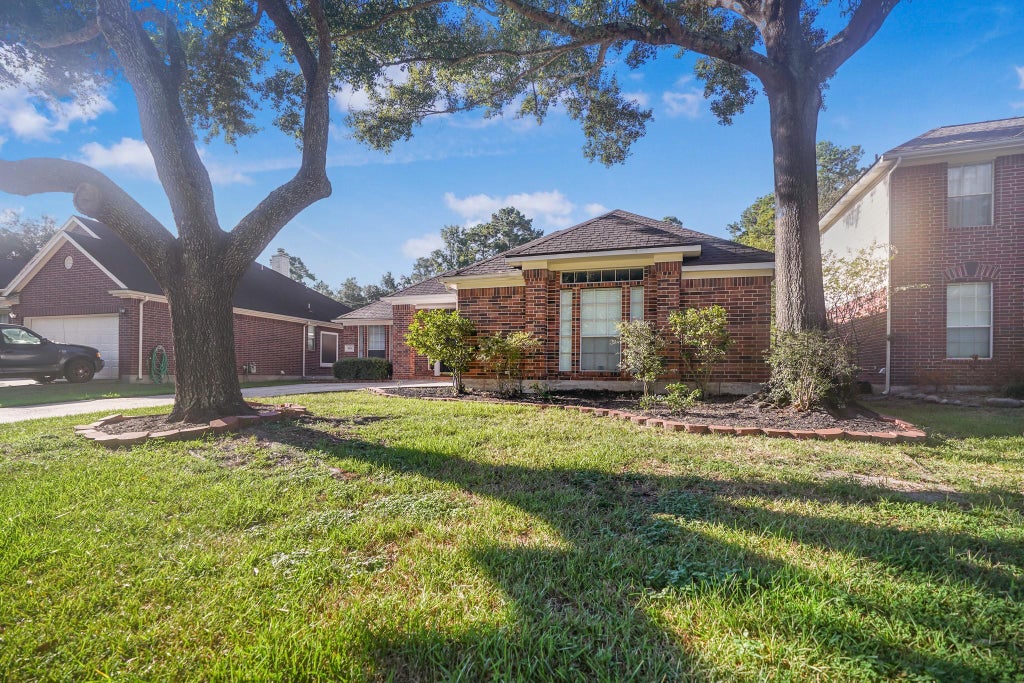Photo of 1602 Summer Rain Drive, Houston, TX 77339 (MLS # 98685245)