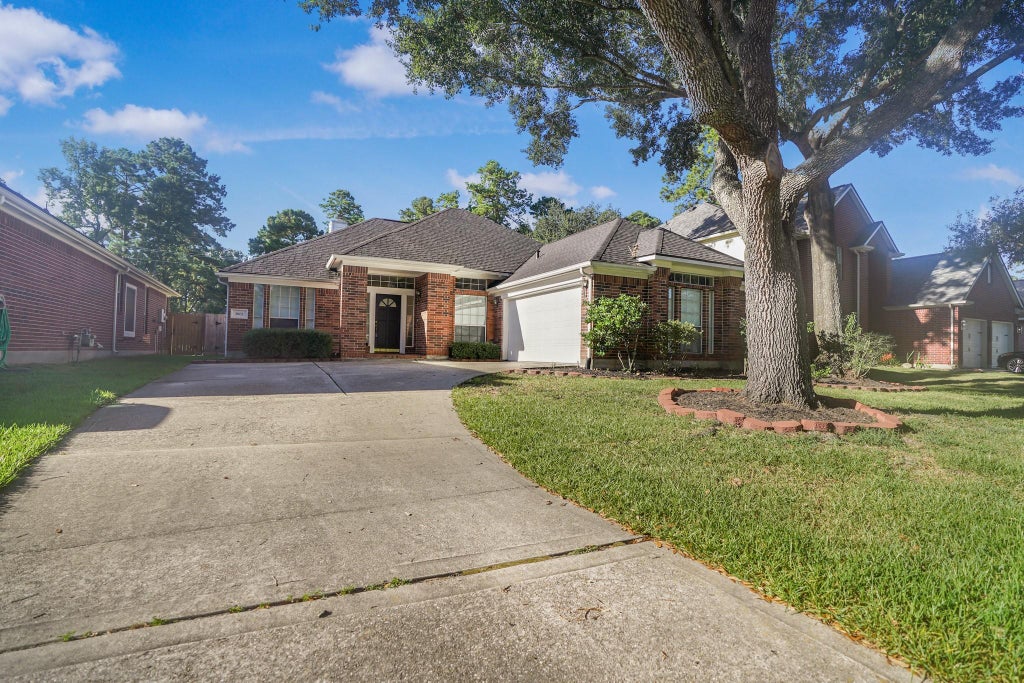 Photo of 1602 Summer Rain Drive, Houston, TX 77339 (MLS # 98685245)