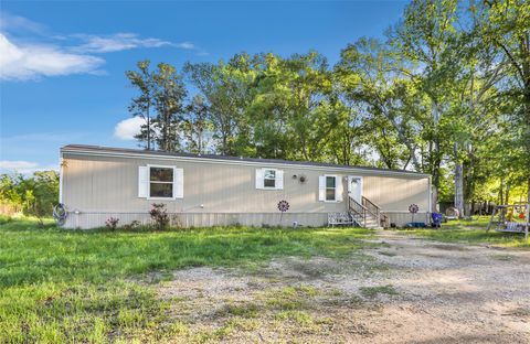 Photo of 1027 County Road 3141 E, Cleveland, TX 77327 (MLS # 91489976)