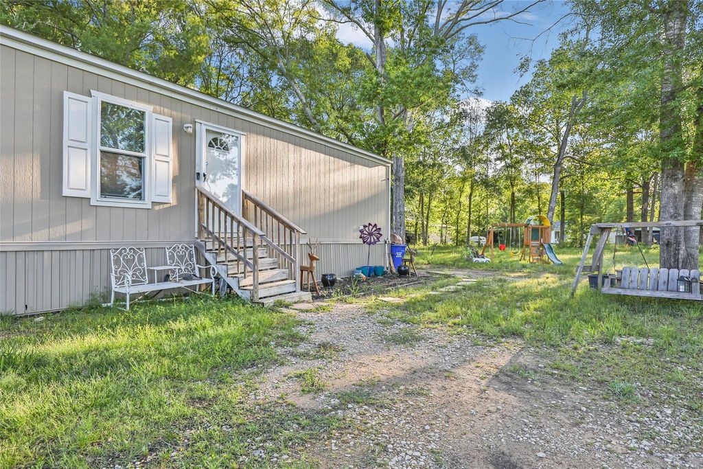 Photo of 1027 County Road 3141 E, Cleveland, TX 77327 (MLS # 91489976)