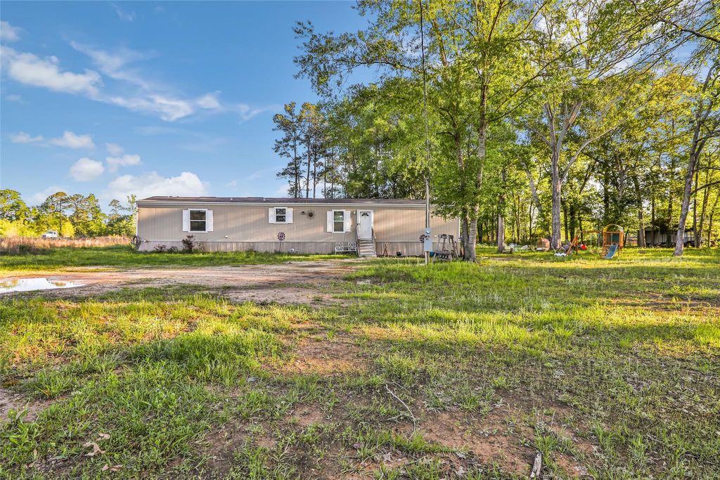 Photo of 1027 County Road 3141 E, Cleveland, TX 77327 (MLS # 91489976)