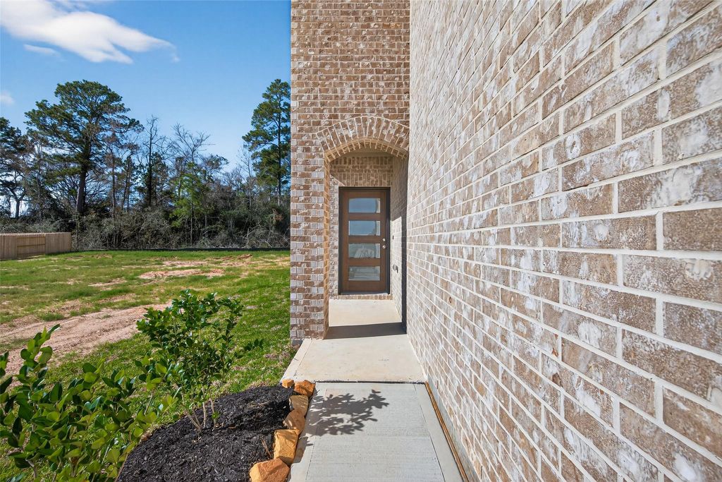 Photo of 12371 Sunset Canyon Way, Willis, TX 77318 (MLS # 98298298)