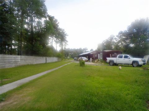 Photo of 1590 County Road 5003, Cleveland, TX 77327 (MLS # 28100279)