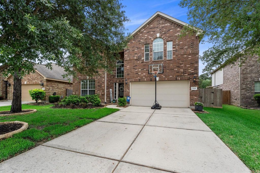 Photo of 13846 Mckinney Creek Lane, Houston, TX 77044 (MLS # 42957712)