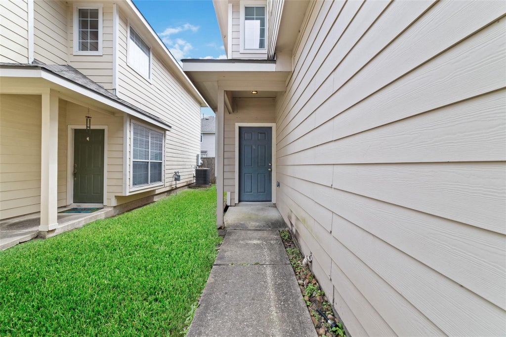 Photo of 8734 Rainglen Lane, Houston, TX 77044 (MLS # 25857988)