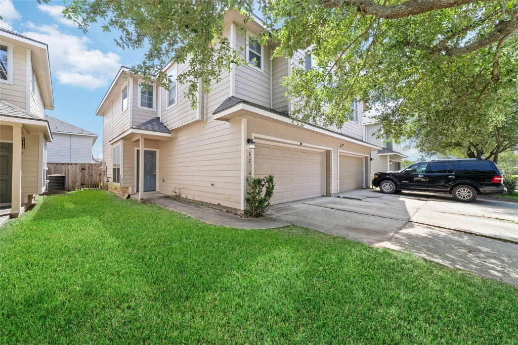 Photo of 8734 Rainglen Lane, Houston, TX 77044 (MLS # 25857988)
