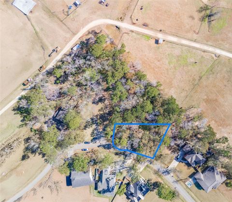 Photo of 26 Holly Springs Dr, Conroe, TX 77302 (MLS # 42104043)