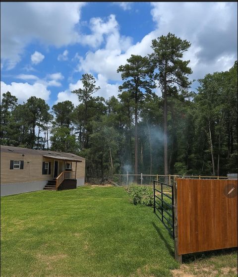 Photo of 8779 Pin Oak Drive, Plantersville, TX 77363 (MLS # 67998958)