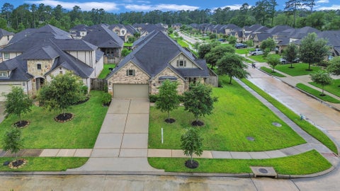 Photo of 561 Rolling Brook Lane, Pinehurst, TX 77362 (MLS # 74918640)