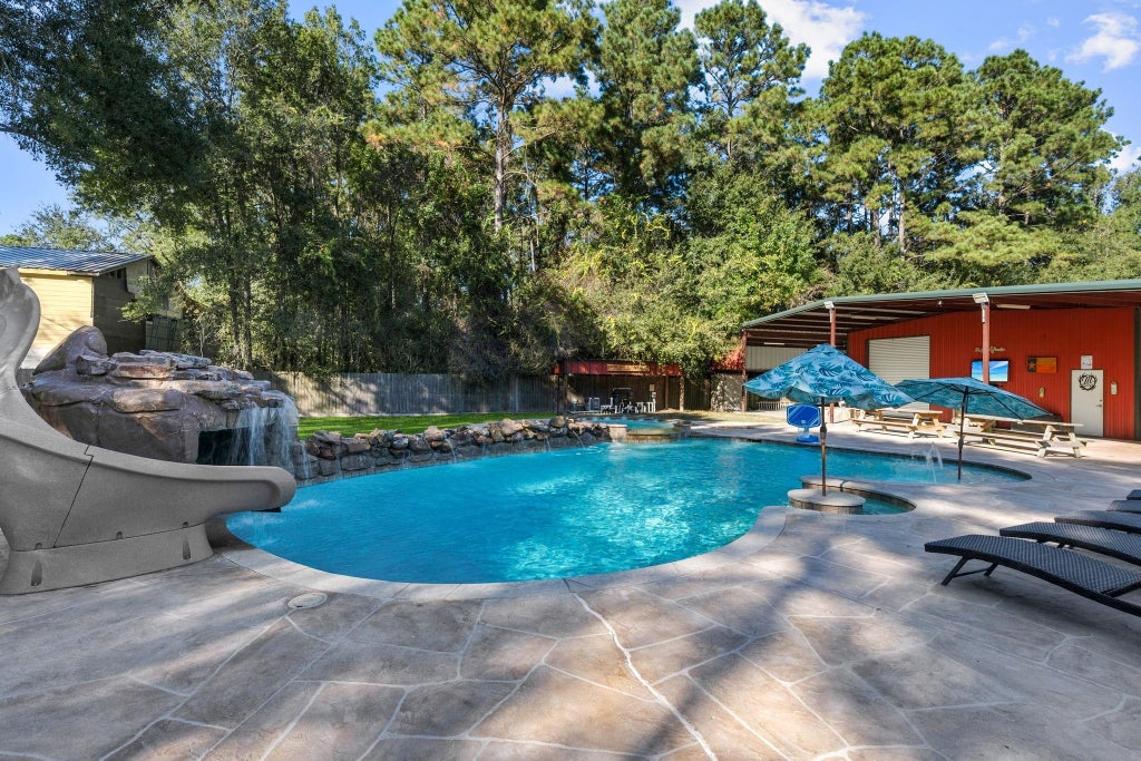 Photo of 247 County Road 3433, Cleveland, TX 77327 (MLS # 59341454)