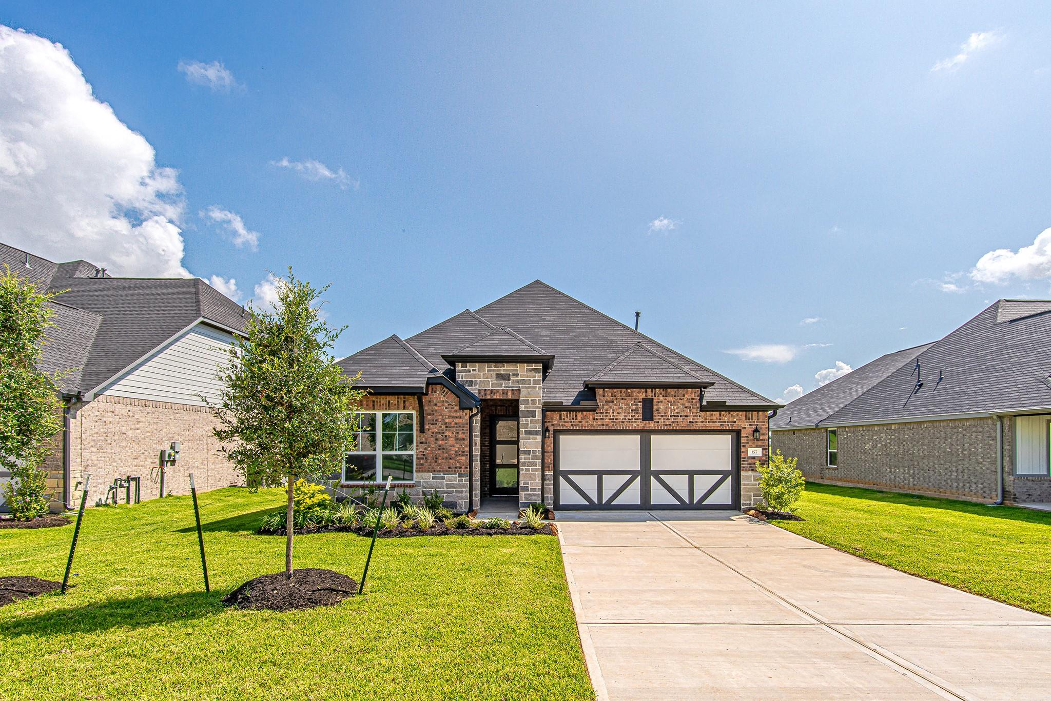 Welcome to 157 Peninsula Point Drive, a beautiful brand-new home in Montgomery's sought-after Waterstone community, offering modern design, quality craftsmanship, and exceptional curb appeal