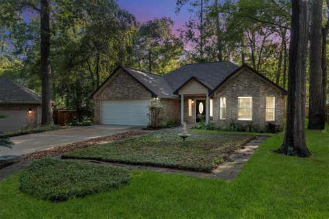 Photo of 128 E Park Drive, Conroe, TX 77356 (MLS # 72858042)