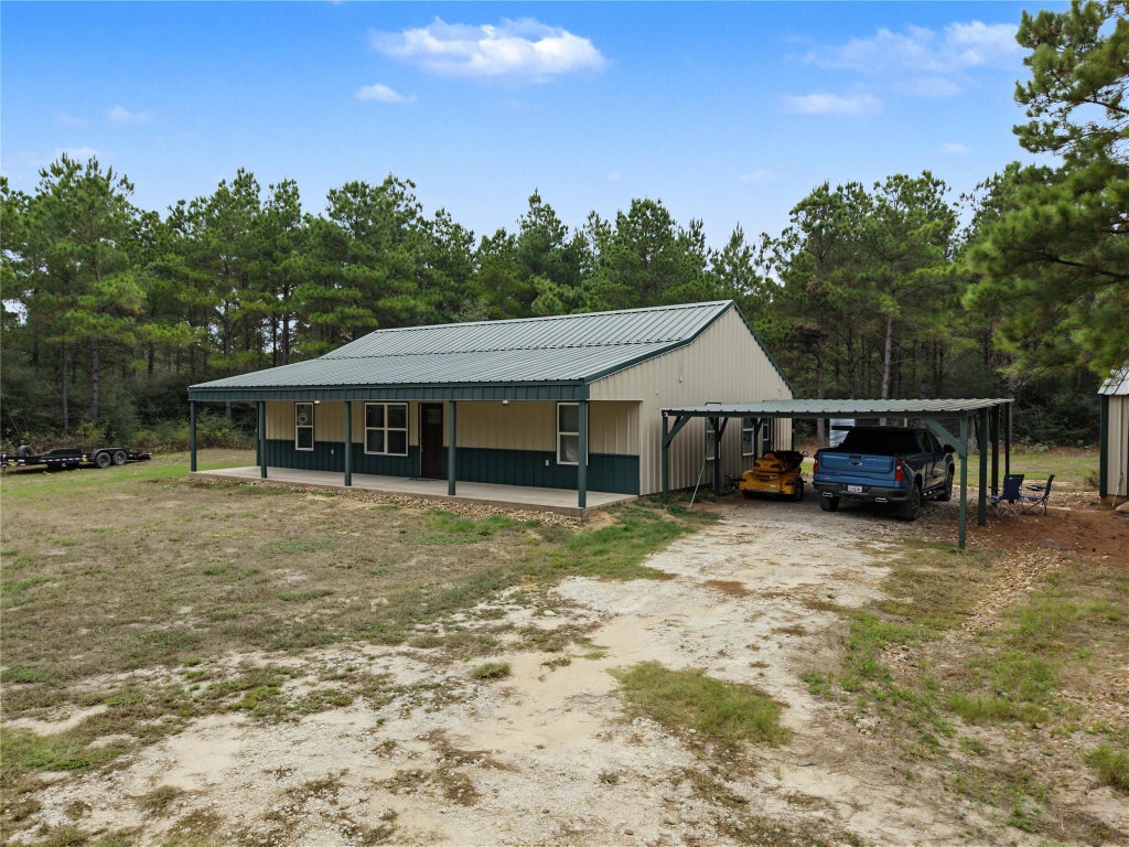 Photo of 56 Lost Indian Camp Road, Huntsville, TX 77320 (MLS # 52739796)