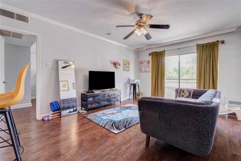 Photo of 4515 Briar Hollow Place #215, Houston, TX 77027 (MLS # 92216192)