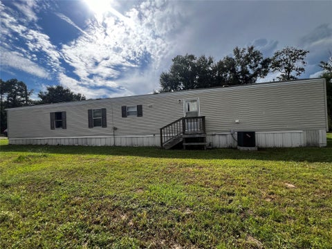 Photo of 801 County Road 3542, Cleveland, TX 77327 (MLS # 91344858)