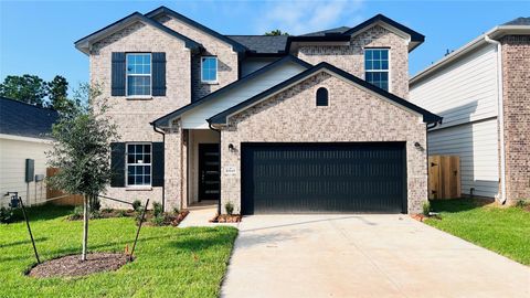 Photo of 10645 Altitude Way, Conroe, TX 77303 (MLS # 31068620)