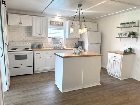 Photo of 302 2nd Street, Palacios, TX 77465 (MLS # 83077616)