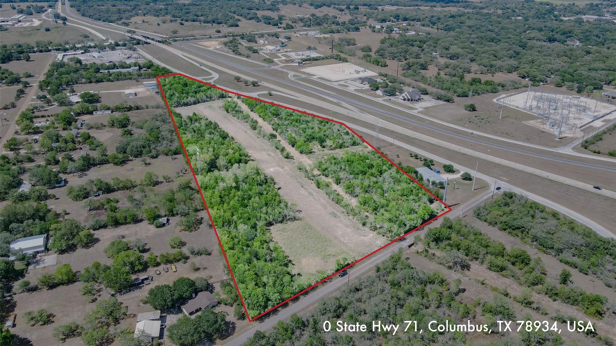 Aerial view of property with access to I-10 and Hwy 71.