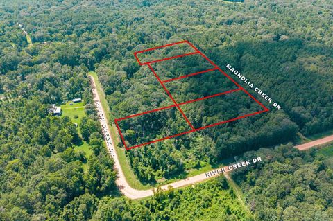 Photo of 0 Magnolia Creek Dr, Cleveland, TX 77328 (MLS # 22873349)