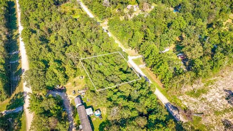 Photo of TBD 26 Timber Grove LN, Livingston, TX 77351 (MLS # 58585582)