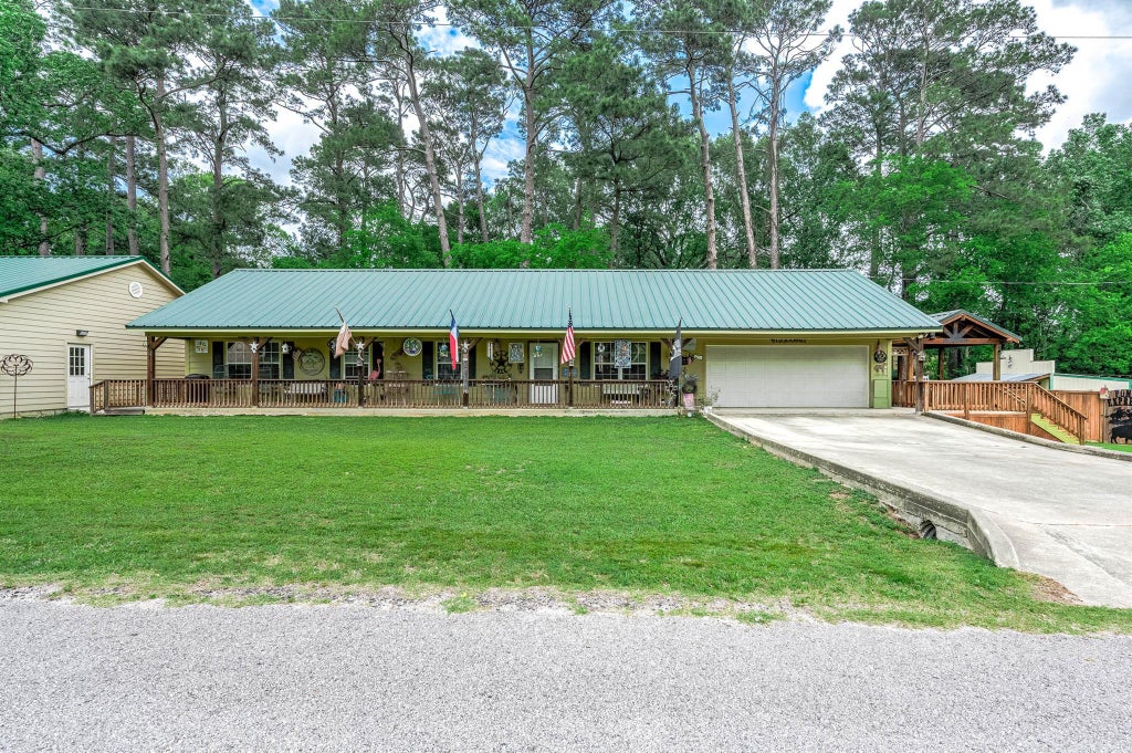 Photo of 100 Magnolia Place, Coldspring, TX 77331 (MLS # 42849385)
