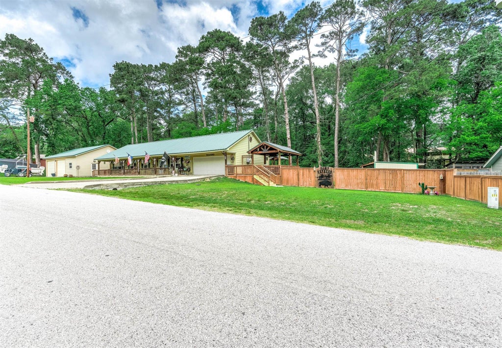 Photo of 100 Magnolia Place, Coldspring, TX 77331 (MLS # 42849385)