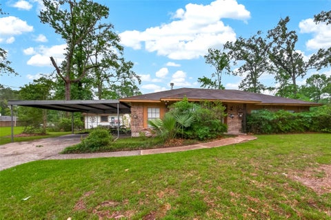 Photo of 262 Magnolia Road, Woodbranch, TX 77357 (MLS # 49402842)