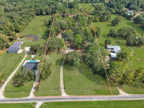 Photo of 390 County Road 2230, Cleveland, TX 77327 (MLS # 40272030)