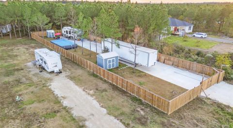 Photo of 510 Road 5512, Cleveland, TX 77327 (MLS # 22395973) Photo of 510 Road 5512, Cleveland, TX 77327 (MLS # 22395973)