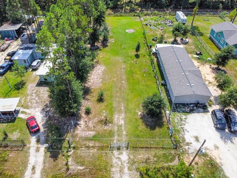 Photo of 1317 County Road 5003, Cleveland, TX 77327 (MLS # 58009513)