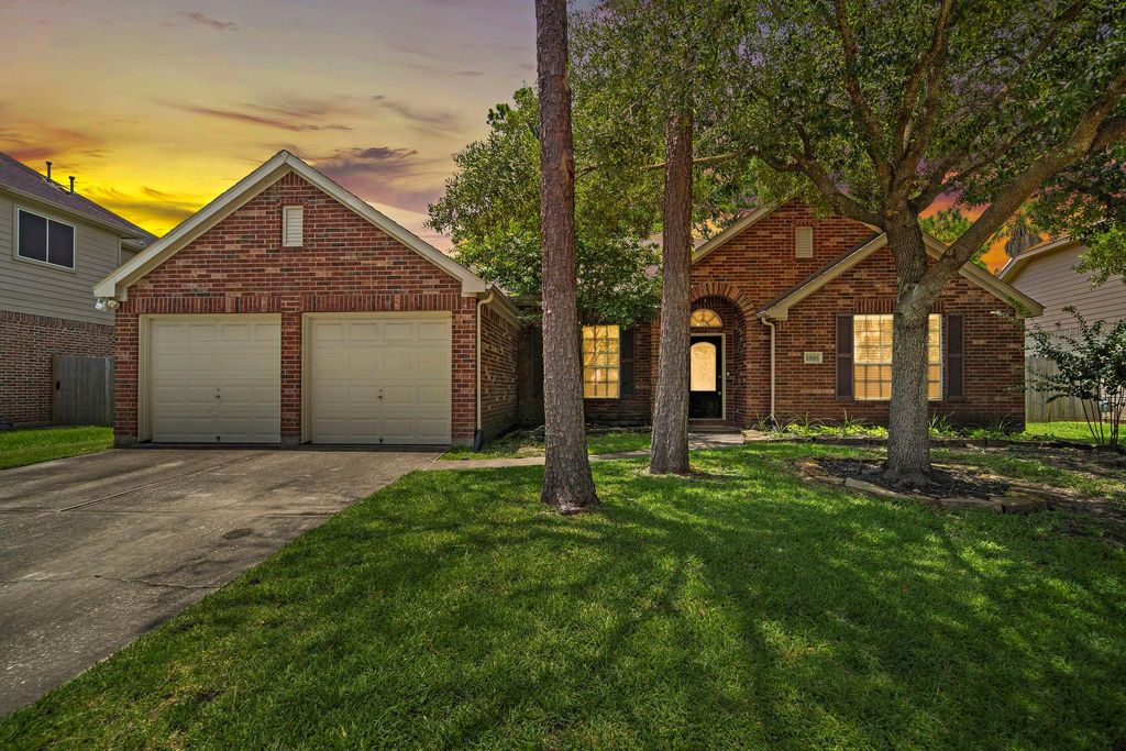Photo of 15015 Cozy Hollow Lane, Houston, TX 77044 (MLS # 36918195)