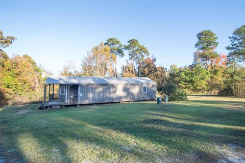 Photo of 140 Lagoon Ct Ct, Point Blank, TX 77364 (MLS # 50325374)