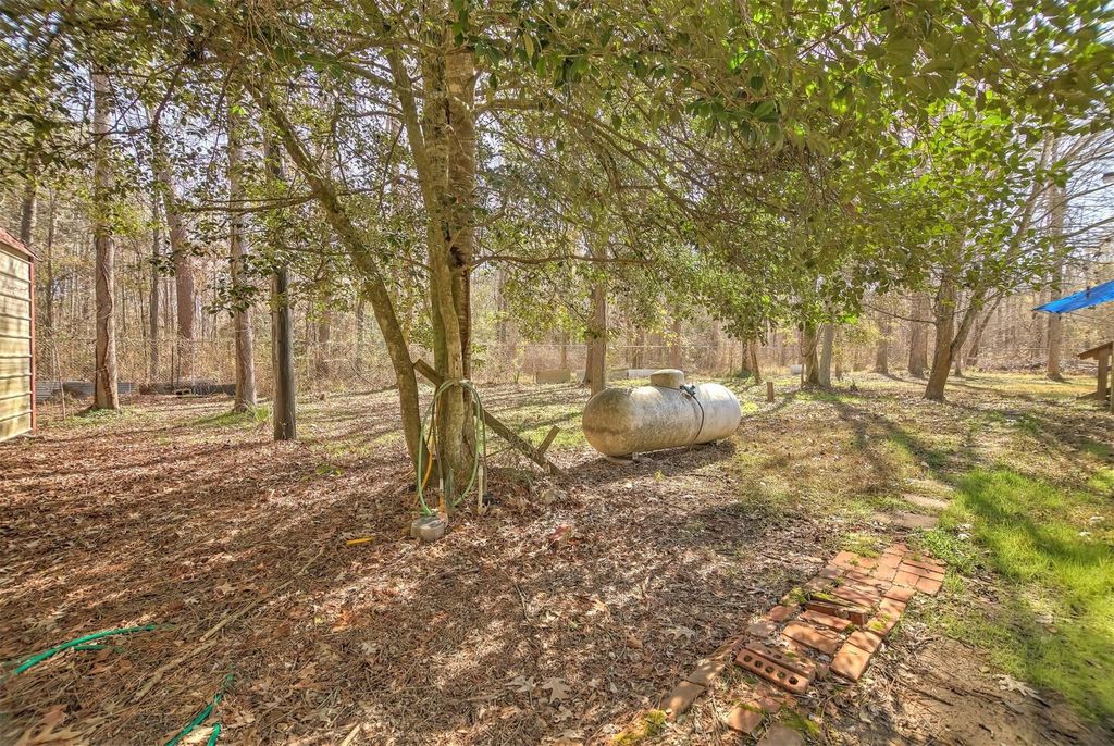 Photo of 73 County Road 2076, Hull, TX 77564 (MLS # 85291751)