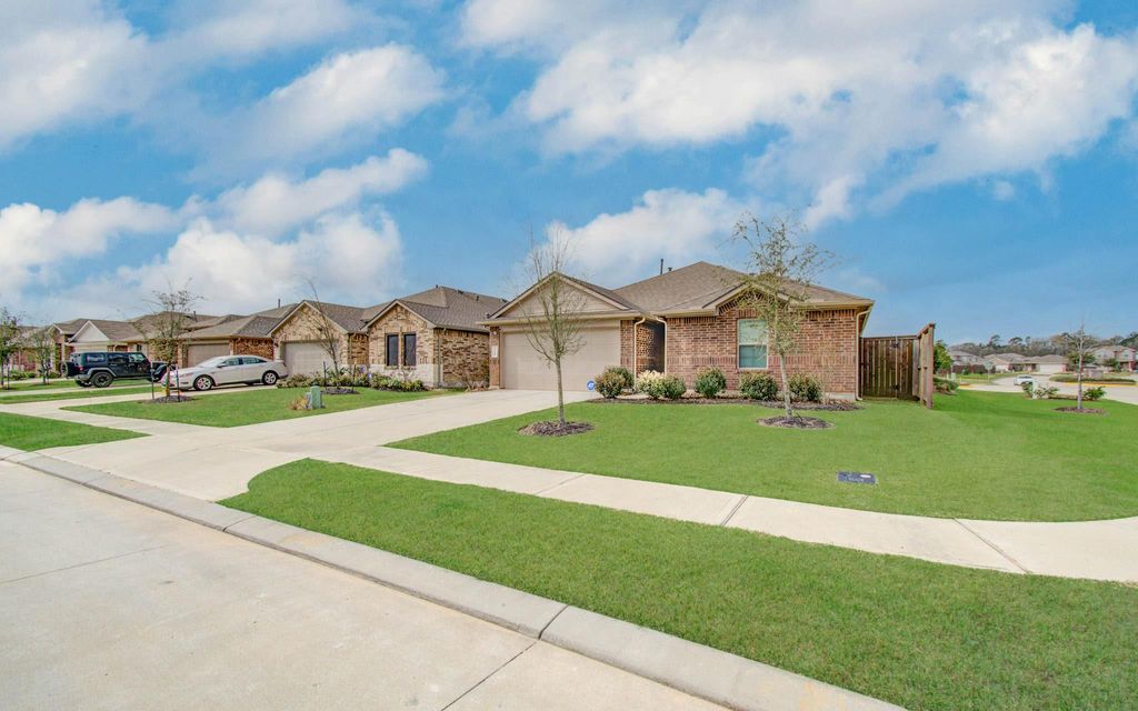 Photo of 14344 Rain Drive, New Caney, TX 77357 (MLS # 82817478)