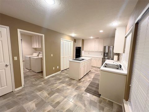 Photo of 12219 Ashling Drive, Houston, TX 77477 (MLS # 15766707)