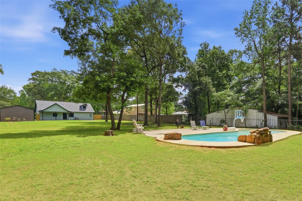 Photo of 12739 Woodcreek Drive, Willis, TX 77318 (MLS # 73595370)