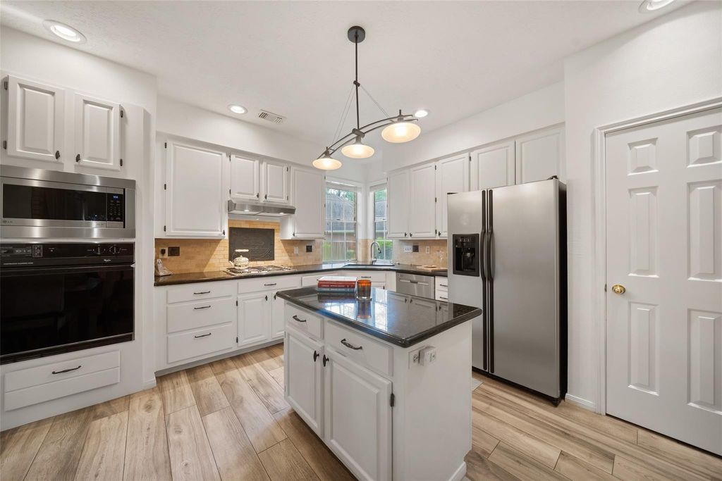 Photo of 3410 Meadow Glade Circle, Houston, TX 77345 (MLS # 82168262)