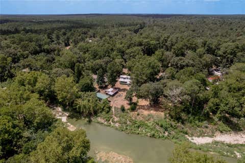 Photo of 8 Creek Road, Huntsville, TX 77320 (MLS # 85870104)