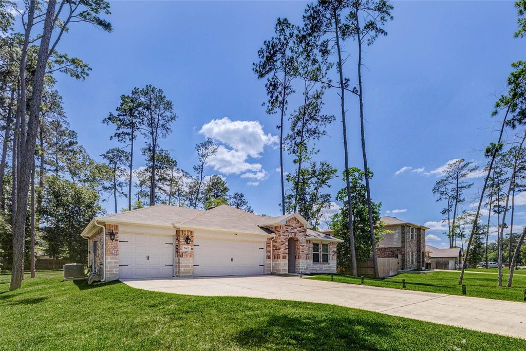 Photo of 2407 S Colosseum Court, New Caney, TX 77357 (MLS # 97740015)