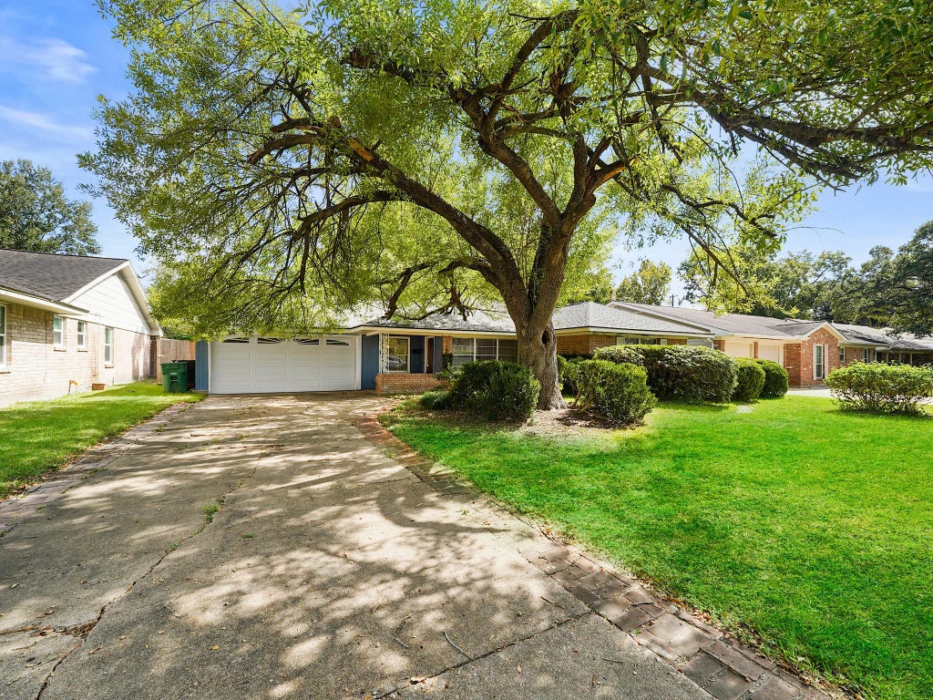 Photo of 9015 Bintliff Drive, Houston, TX 77074 (MLS # 74896906)