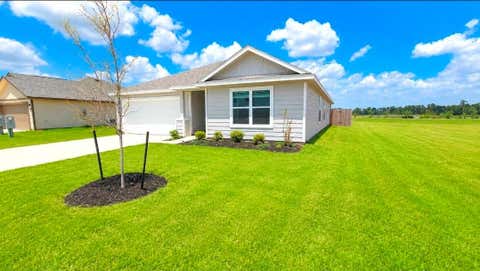 Photo of 10485 Sugar Mill Dr, Conroe, TX 77306 (MLS # 18822504)