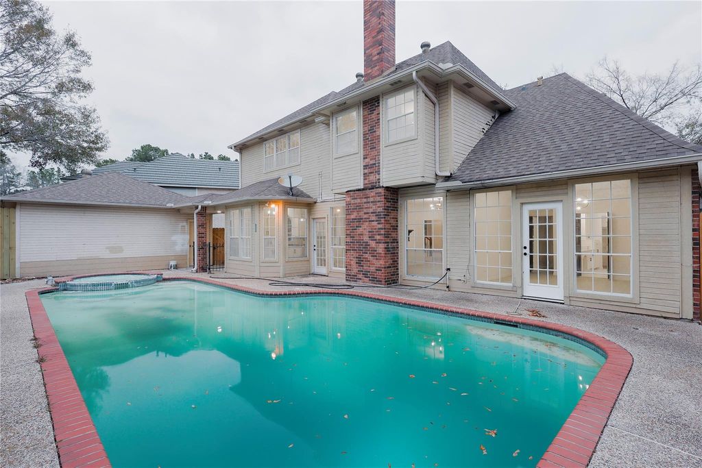 Photo of 17527 Sandy Cliffs Drive, Houston, TX 77090 (MLS # 56734329)