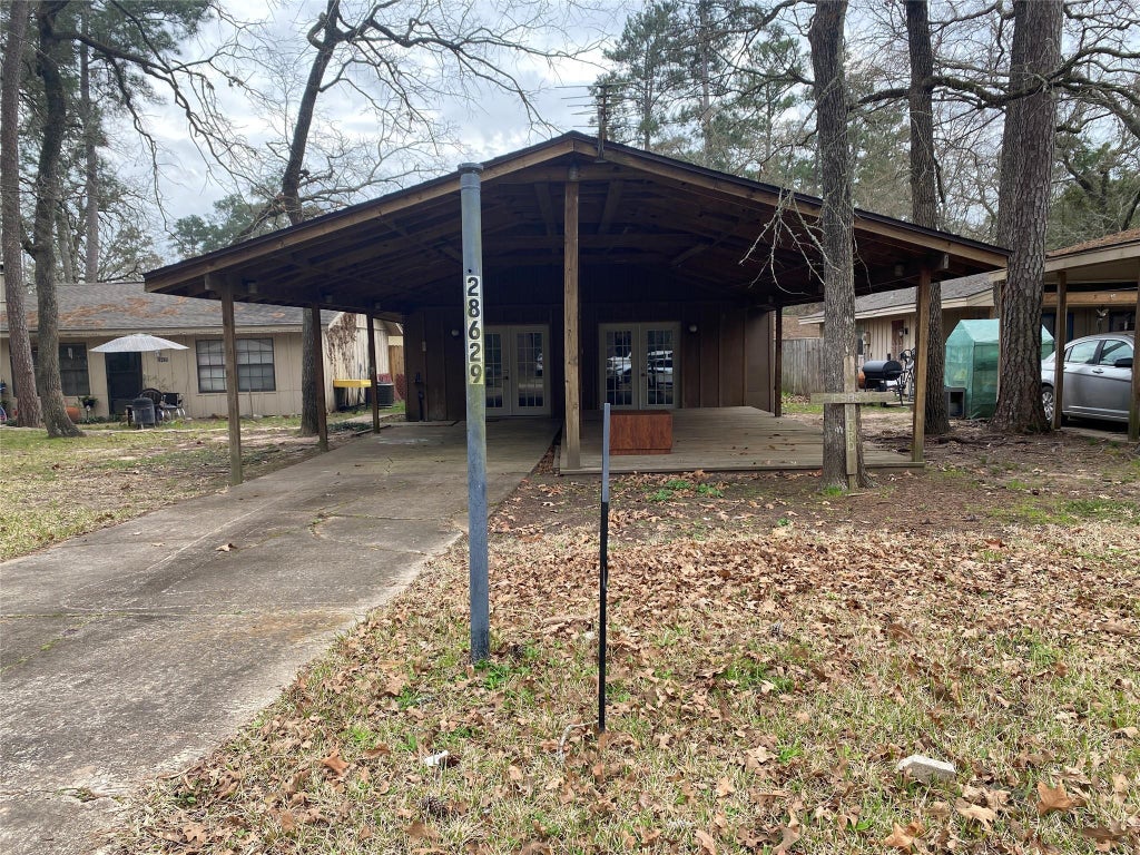 Photo of 28629 Netawaka Ct, Huntsville, TX 77320 (MLS # 53007243)