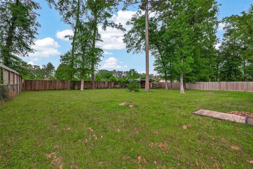 Photo of 23249 E Community Drive, New Caney, TX 77357 (MLS # 94291399)