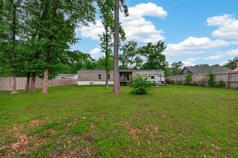 Photo of 23249 E Community Drive, New Caney, TX 77357 (MLS # 94291399)