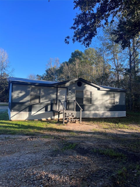 Photo of 401 County Road 2296, Cleveland, TX 77327 (MLS # 30899179)